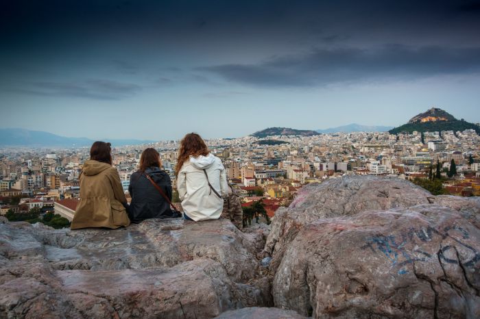 Friends sitting on Acropolis rock