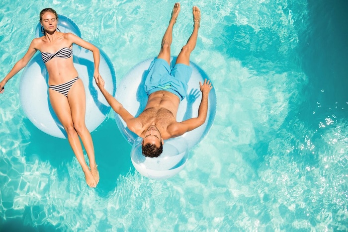 couple on floaties wavebreakmedia shutterstock