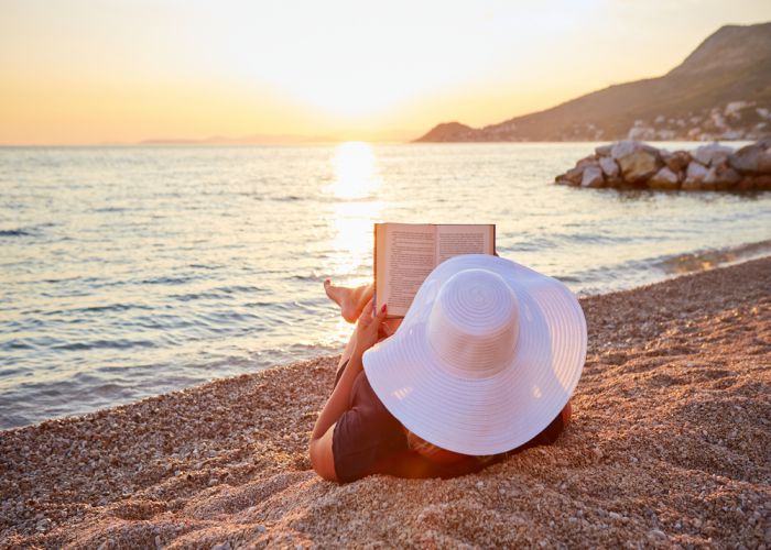 reading by the sea Rostislav Sedlacek shutterstock